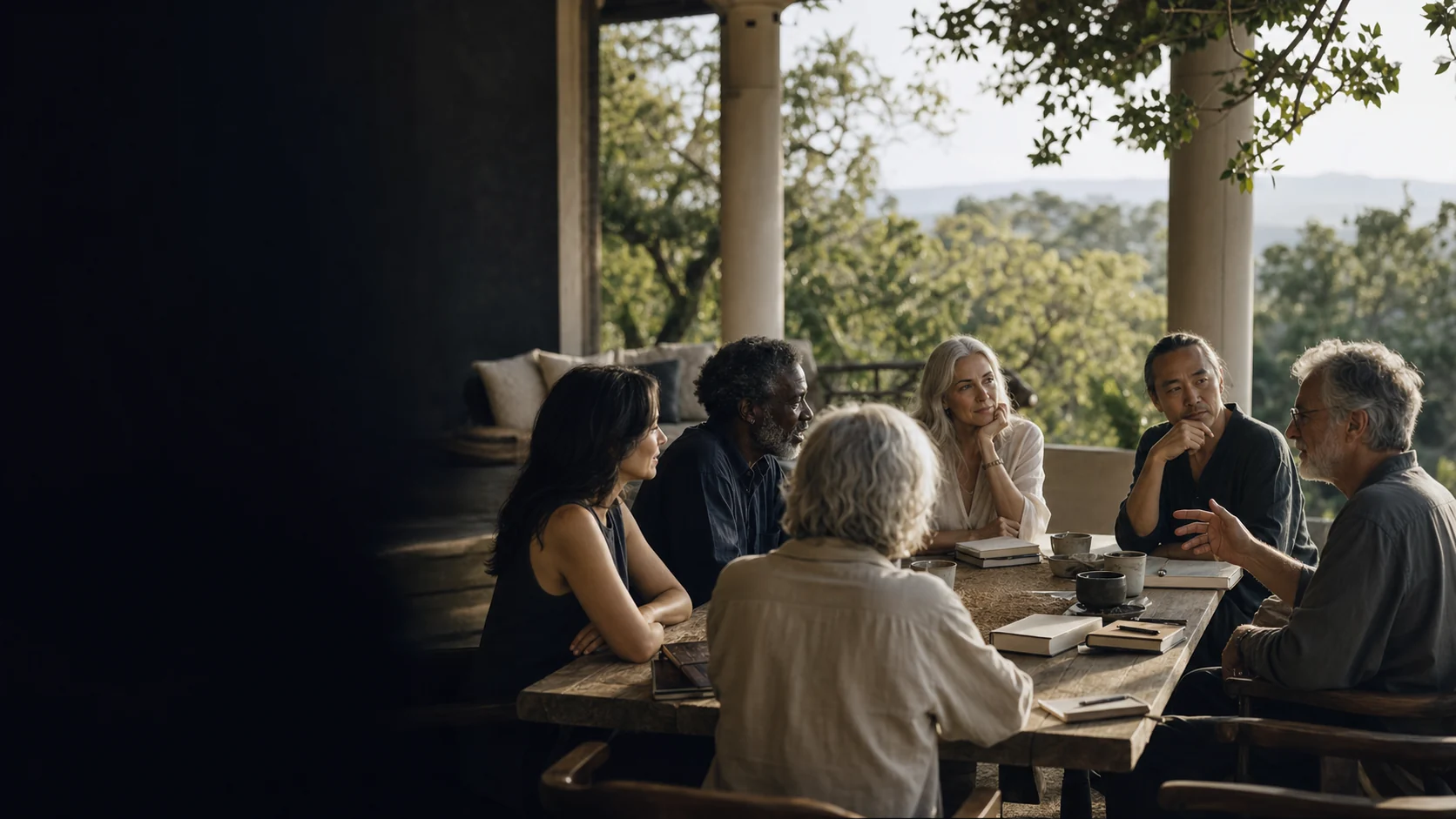 People gathered for thoughtful conversation in an open-air setting